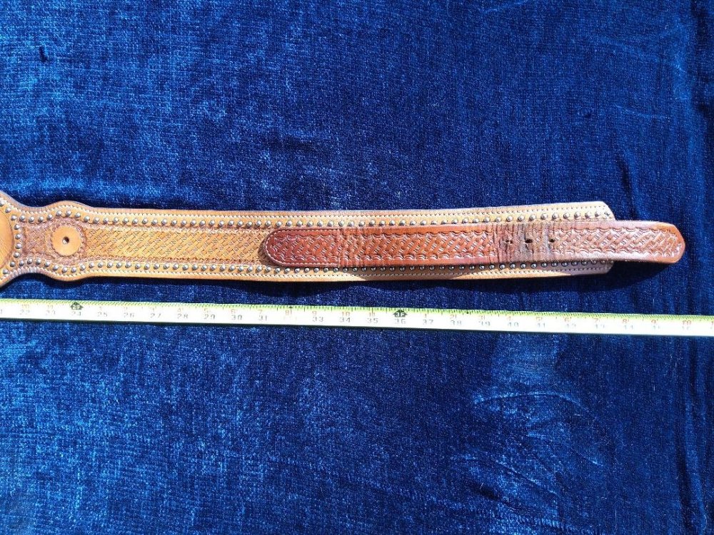 brown holster belt end with holes.jpg