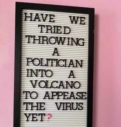 sign-have-we-tried-throwing-politician-into-volcano-to-appease-virus-yet.jpg