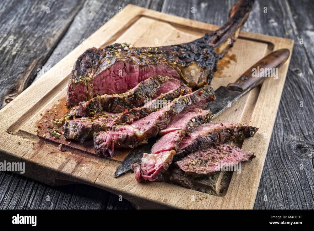 barbecue-tomahawk-steak-on-old-cutting-board-M4D8HT.thumb.jpg.00667ee1384e877100ef3d1e31abb019.jpg