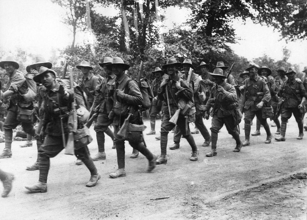 1880368317_Australian_troops_marching_along_a_road_France_during_World_War_I_(3012657832).thumb.jpg.43c0c54200428c2a5a985a29a10de160.jpg