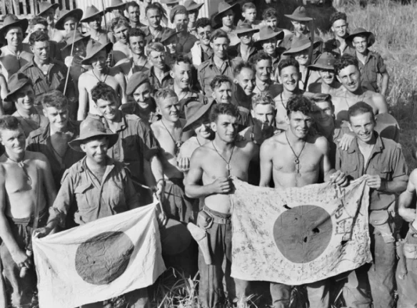 22nd-september-1943-australian-soldiers-from-the-2-6th-independent-company-diplay-japanese-flags-the--of-kaiapit-between-19-and-20-september-1943-second-worl1.webp.a60b4a9046044aa991734ced8c8cdb8d.webp